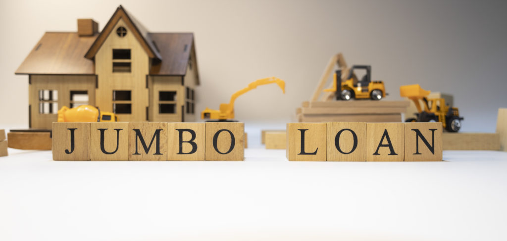 Jumbo loan was created from wooden cubes. Finance and Banking. Close-up.